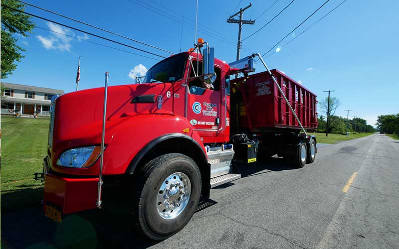 A new Cragco Kenworth roll-off truck on the road in Buffalo, NY